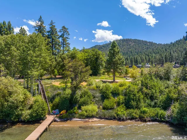 a view of a lake with a yard