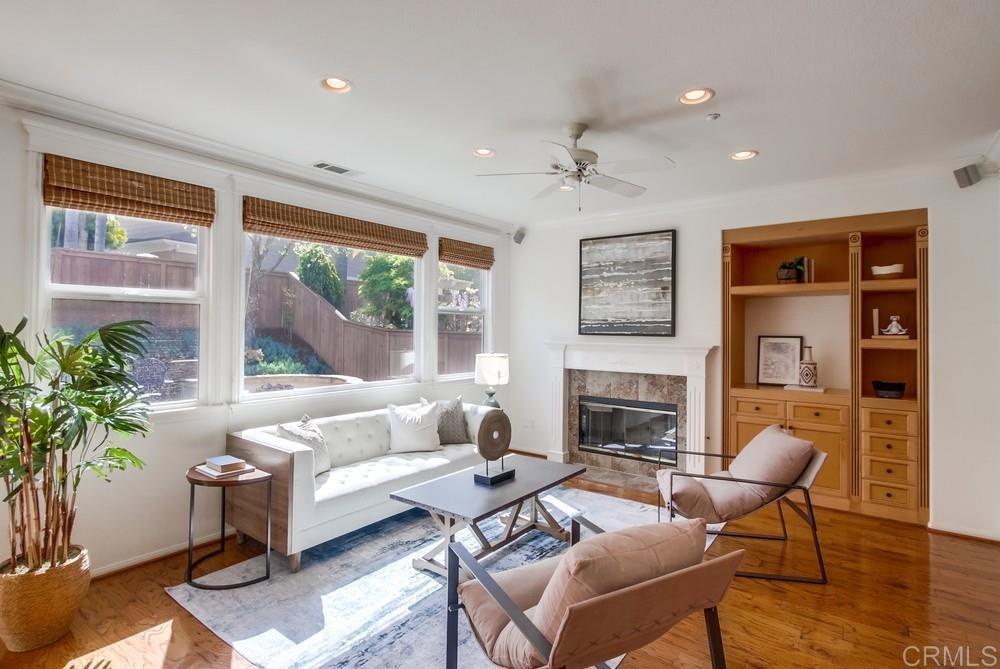 573 Cypress Hills Drive Encinitas, CA 92024 - Photo 12 of 75 a living room with furniture fireplace and a large window