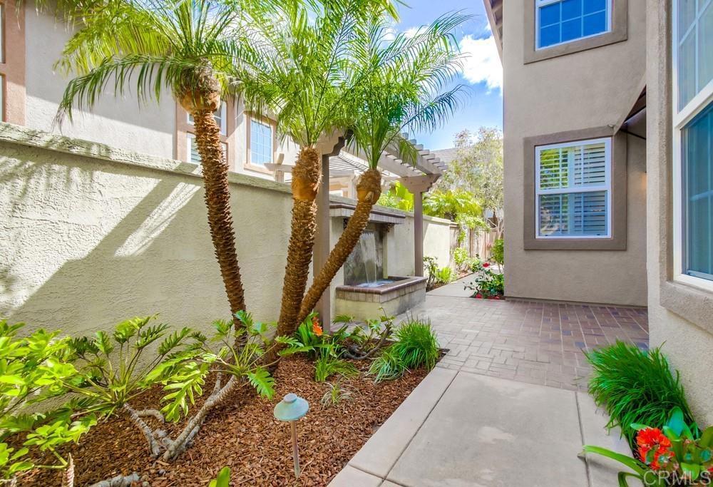 573 Cypress Hills Drive Encinitas, CA 92024 - Photo 4 of 75 a house with trees in front of it