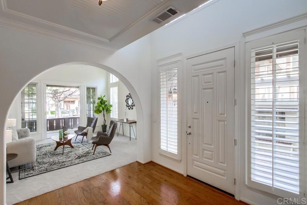573 Cypress Hills Drive Encinitas, CA 92024 - Photo 8 of 75 a living room with furniture and a large window
