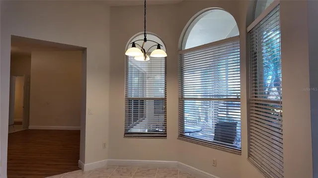 a view of a livingroom with windows