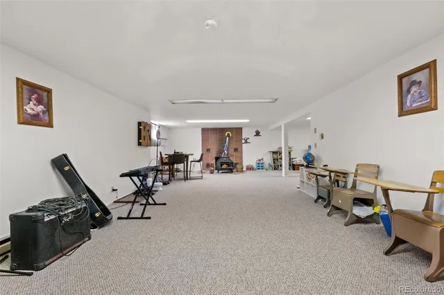 a view of a livingroom with furniture and a flat screen tv