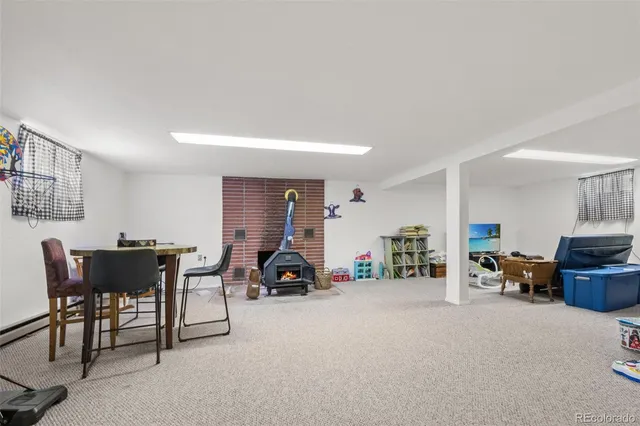 a bedroom with a bed and chair