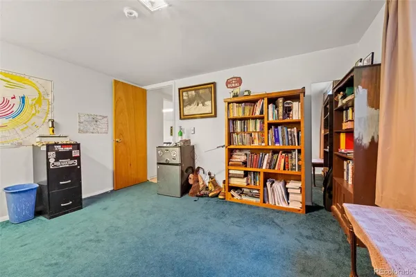 a view of an empty room with window and toys