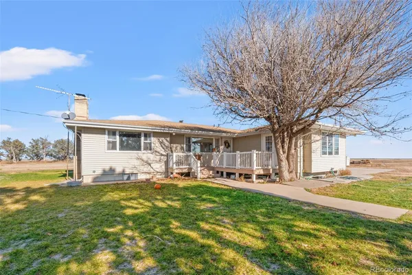 a front view of house with yard having outdoor seating