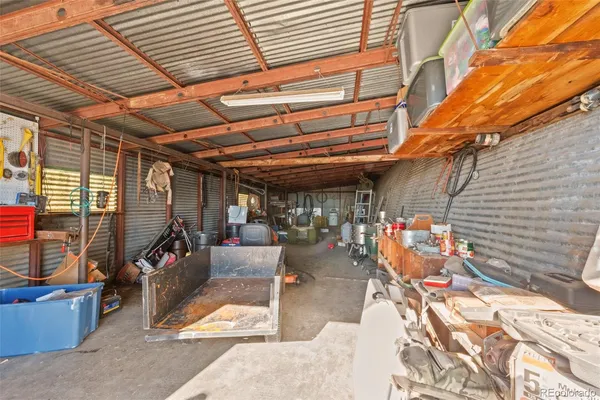 a view of outdoor kitchen with seating area