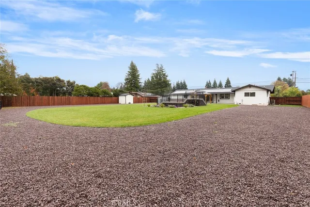 a view of a park with large trees