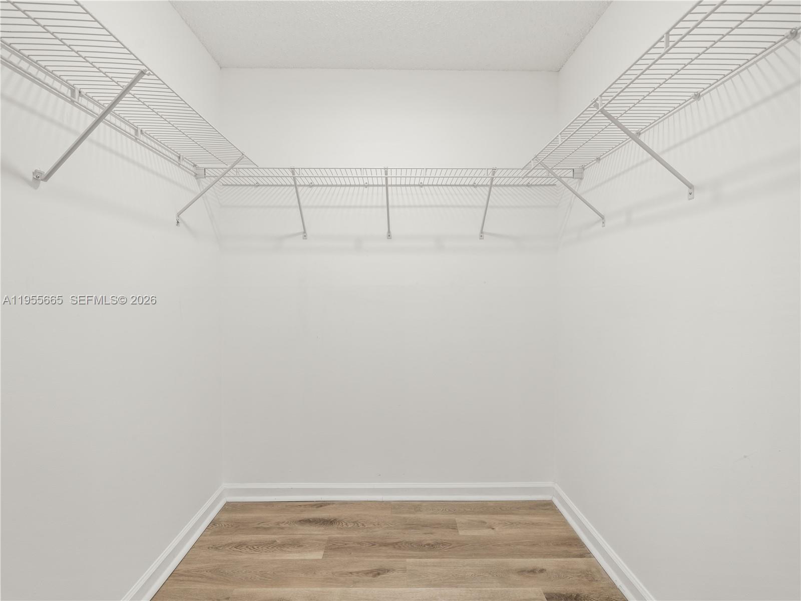 7547 Fairfax Drive, Unit 210 Tamarac, FL 33321 - Photo 20 of 38 a view of a room with racks on the wall