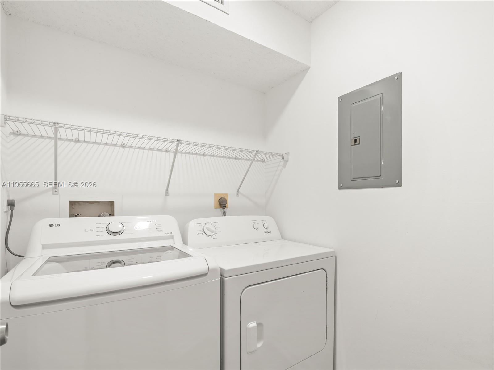 7547 Fairfax Drive, Unit 210 Tamarac, FL 33321 - Photo 24 of 38 a utility room with dryer and washer