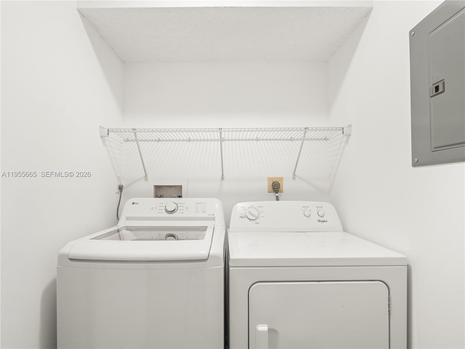 7547 Fairfax Drive, Unit 210 Tamarac, FL 33321 - Photo 25 of 38 a utility room with dryer and washer