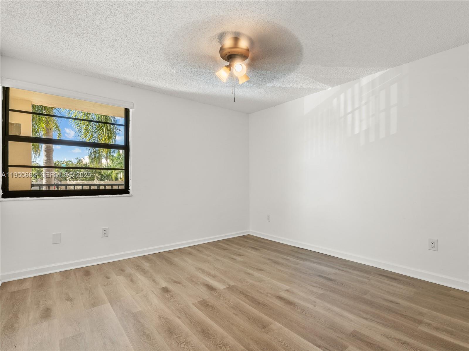 7547 Fairfax Drive, Unit 210 Tamarac, FL 33321 - Photo 26 of 38 a view of an empty room with a window