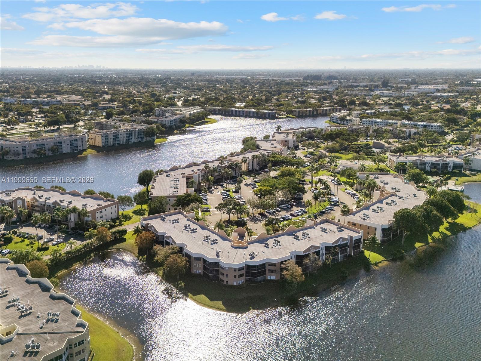 7547 Fairfax Drive, Unit 210 Tamarac, FL 33321 - Photo 30 of 38 an aerial view of a houses with a lake view
