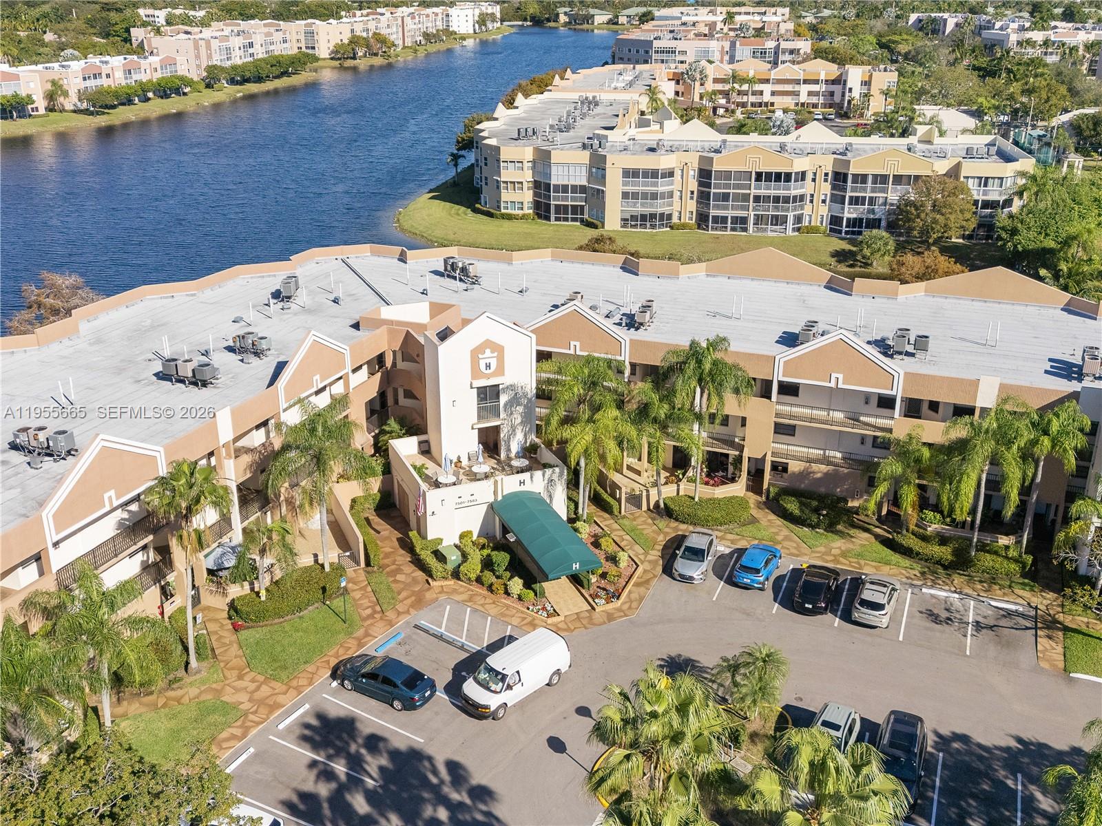 7547 Fairfax Drive, Unit 210 Tamarac, FL 33321 - Photo 31 of 38 an aerial view of residential houses with outdoor space