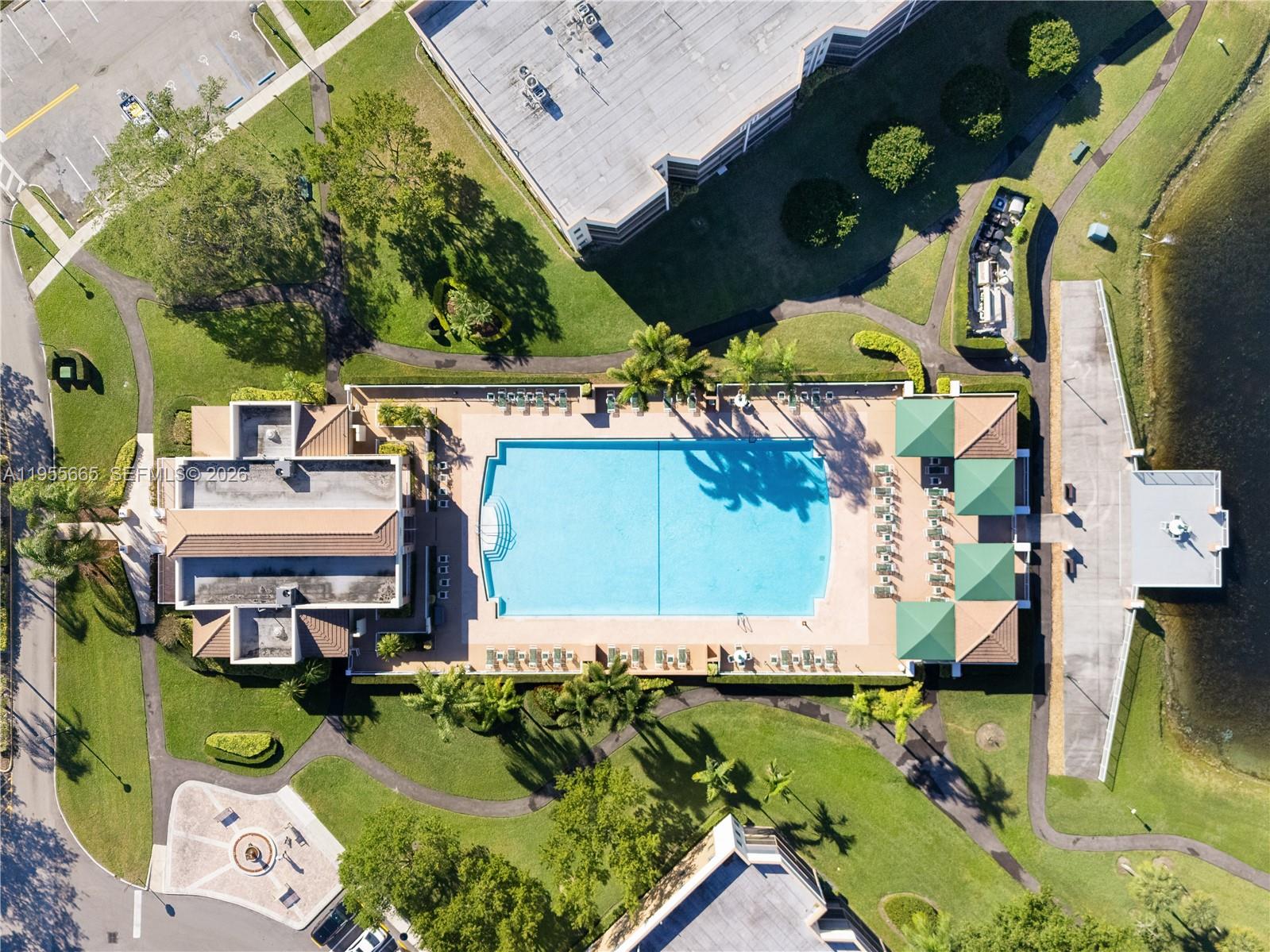 7547 Fairfax Drive, Unit 210 Tamarac, FL 33321 - Photo 32 of 38 an aerial view of a house with a yard basket ball court and outdoor seating