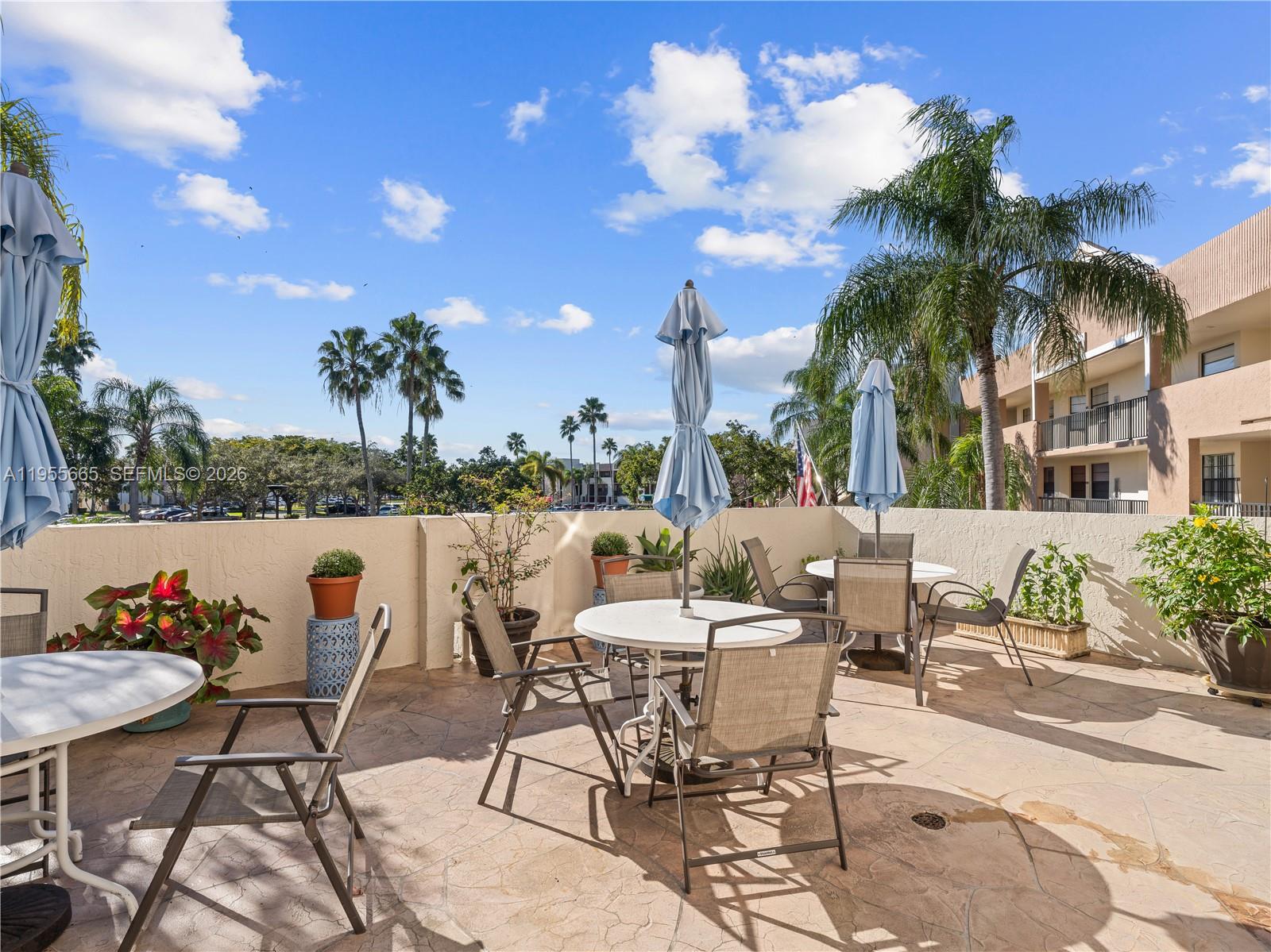 7547 Fairfax Drive, Unit 210 Tamarac, FL 33321 - Photo 34 of 38 a view of swimming pool with outdoor seating