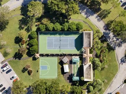 an aerial view of a house with a yard