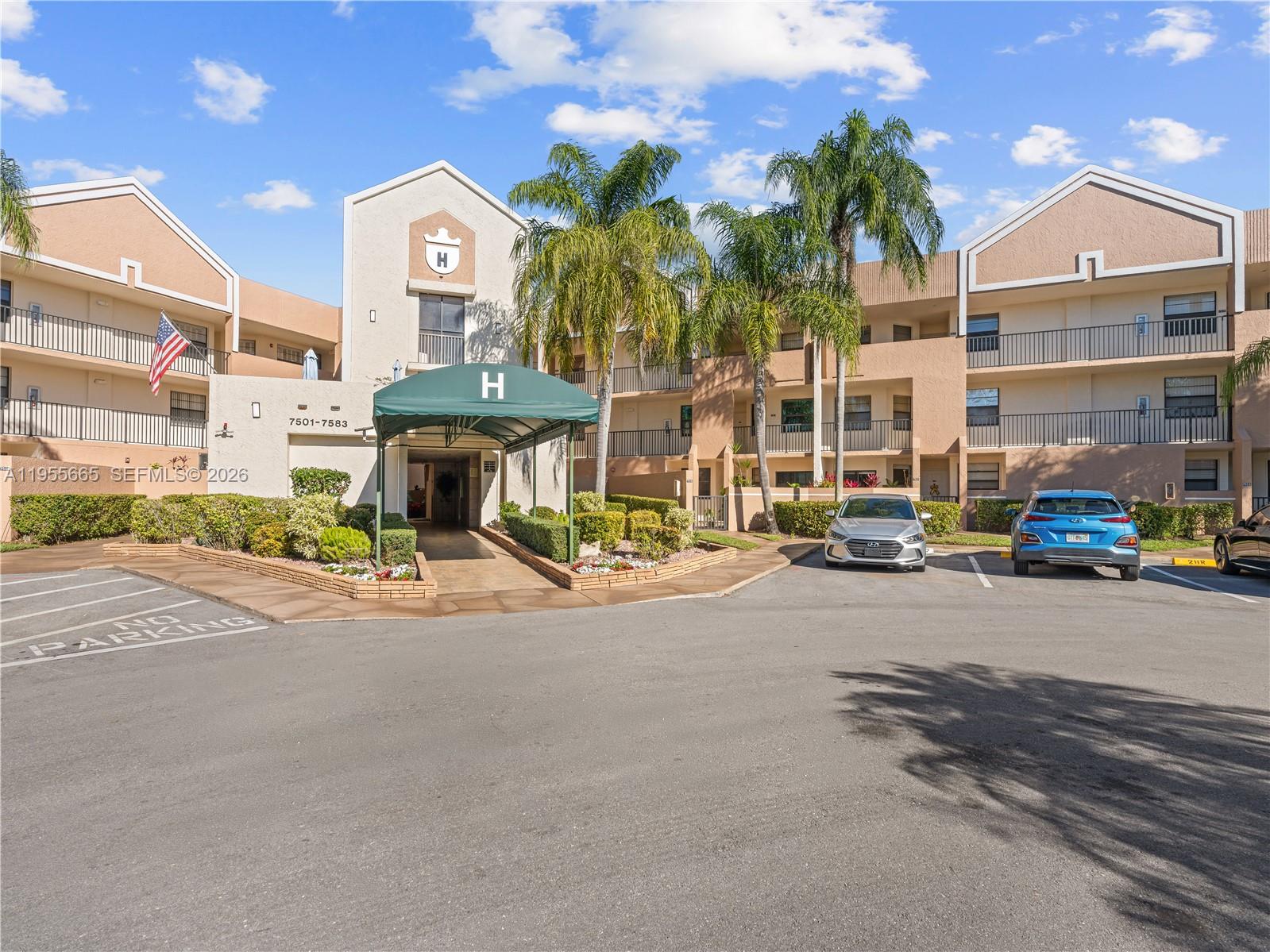 7547 Fairfax Drive, Unit 210 Tamarac, FL 33321 - Photo 38 of 38 a view of a street with cars