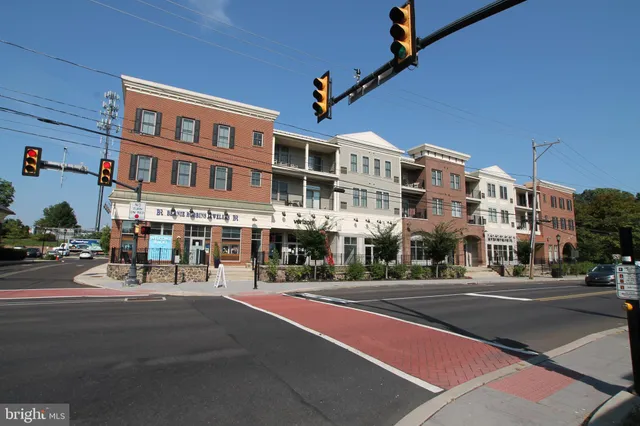 a city street lined with buildings and trees