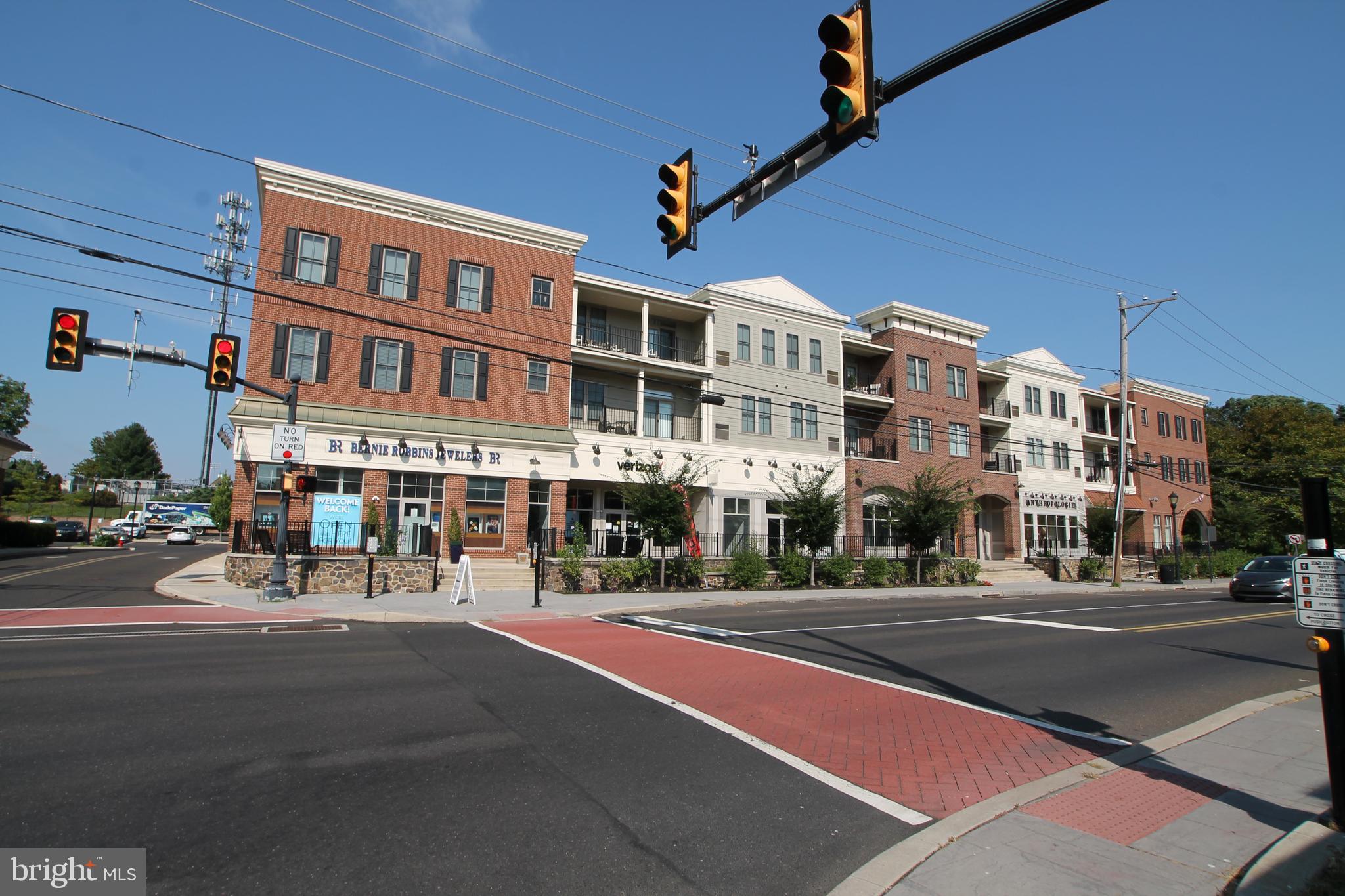 a city street lined with buildings and trees
