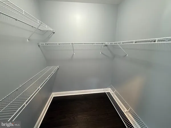 a view of room with racks on the wall