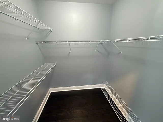 a view of room with racks on the wall