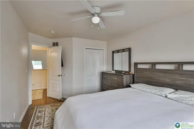 a view of a livingroom with furniture and a flat screen tv