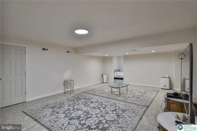 a bedroom with a bed and cabinets