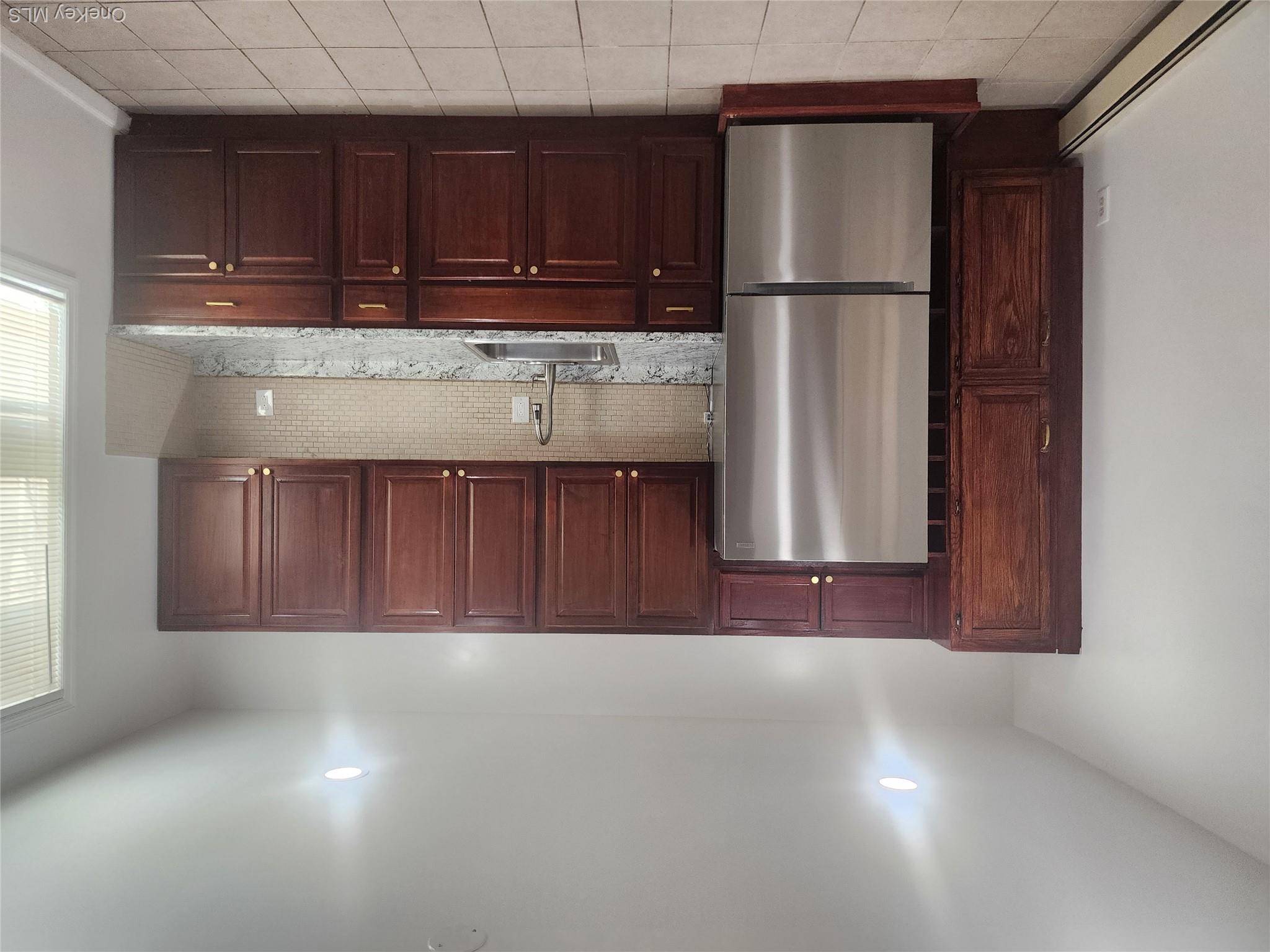 49 Carroll Street, Unit 1 Poughkeepsie, NY 12601 - Photo 13 of 15 a kitchen with a refrigerator and a sink