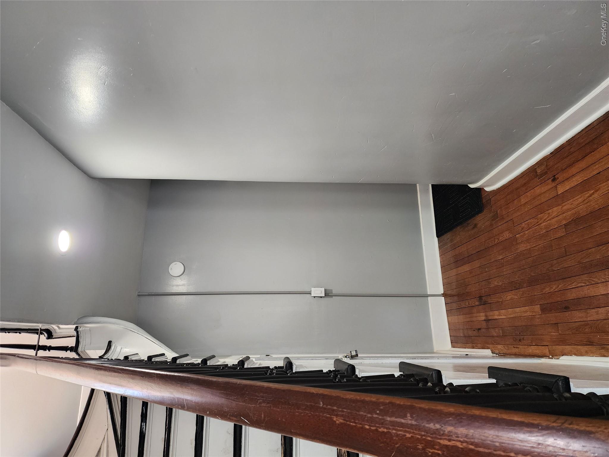 49 Carroll Street, Unit 1 Poughkeepsie, NY 12601 - Photo 5 of 15 wooden floor in an empty room