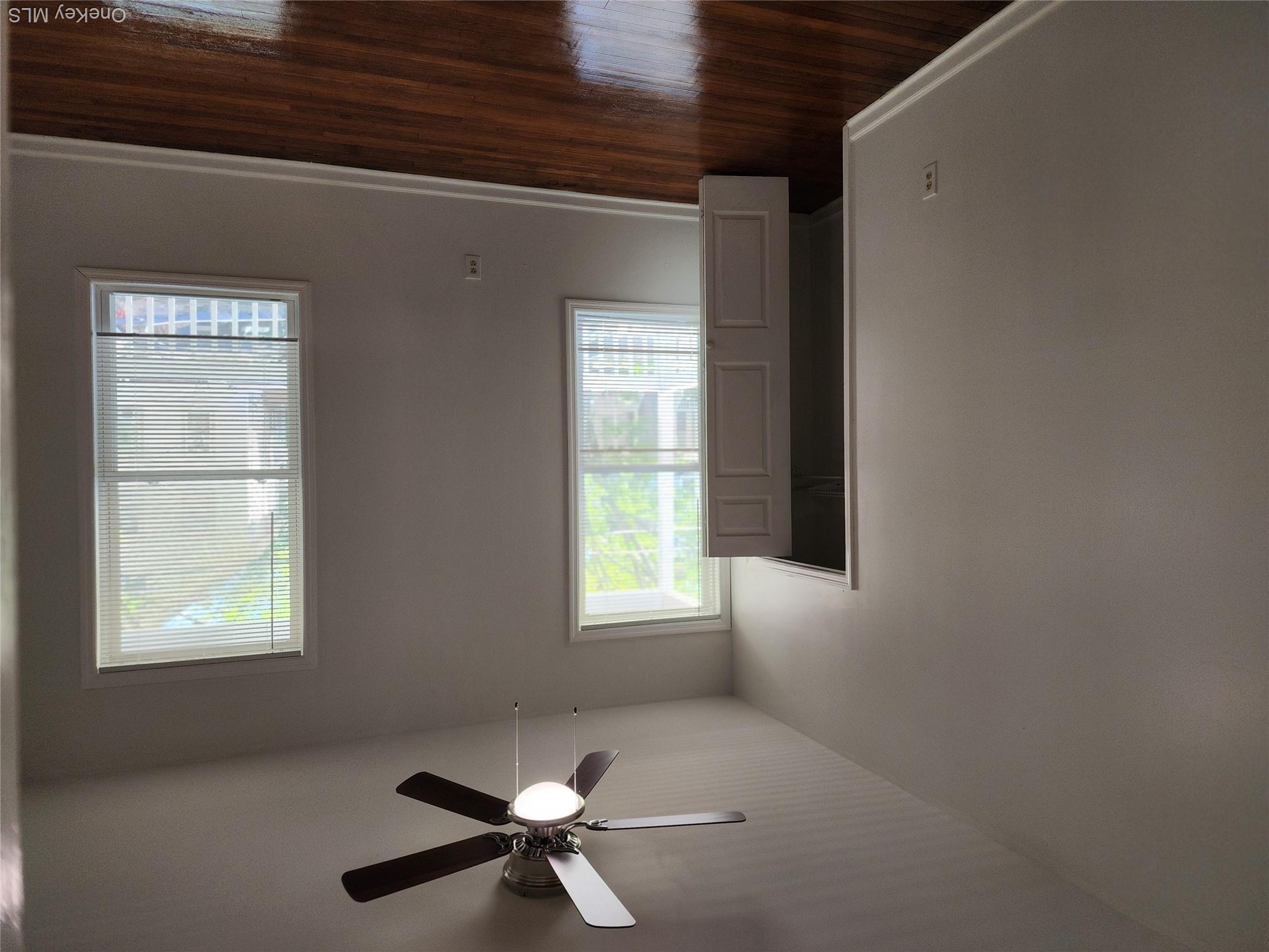 49 Carroll Street, Unit 1 Poughkeepsie, NY 12601 - Photo 8 of 15 a view of an empty room with wooden floor and a window