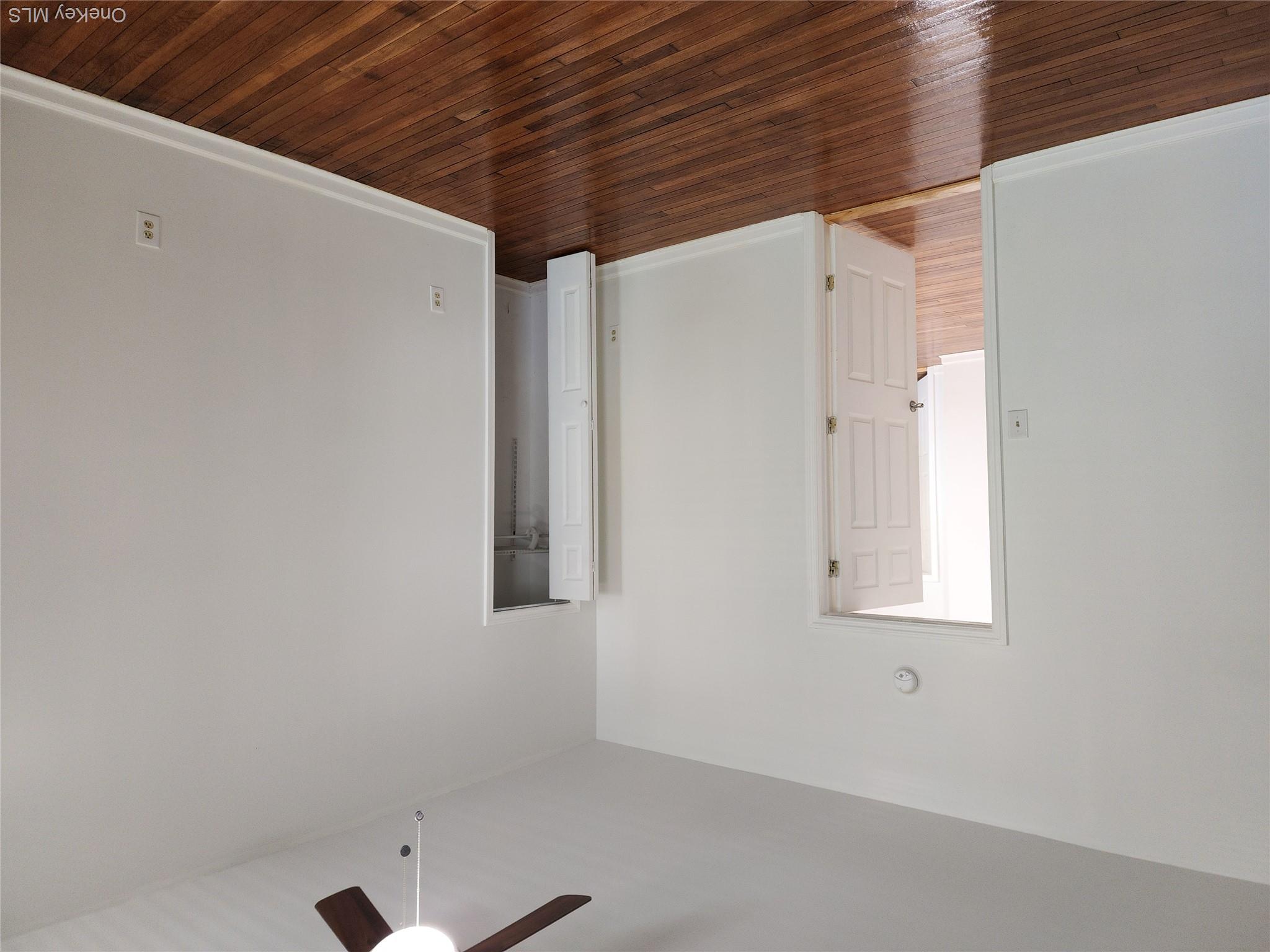 49 Carroll Street, Unit 1 Poughkeepsie, NY 12601 - Photo 9 of 15 a view of an empty room with wooden floor