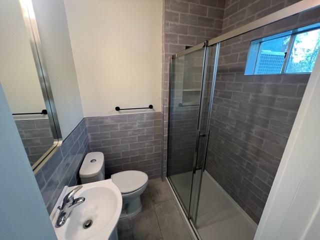 4417 Lucksinger Lane, Unit B Austin, TX 78745 - Photo 11 of 12 a bathroom with a toilet and a shower
