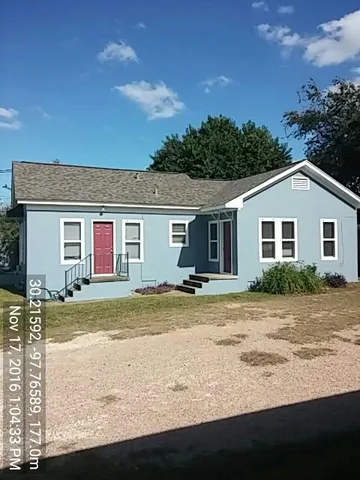 a view of a yard in front of a house