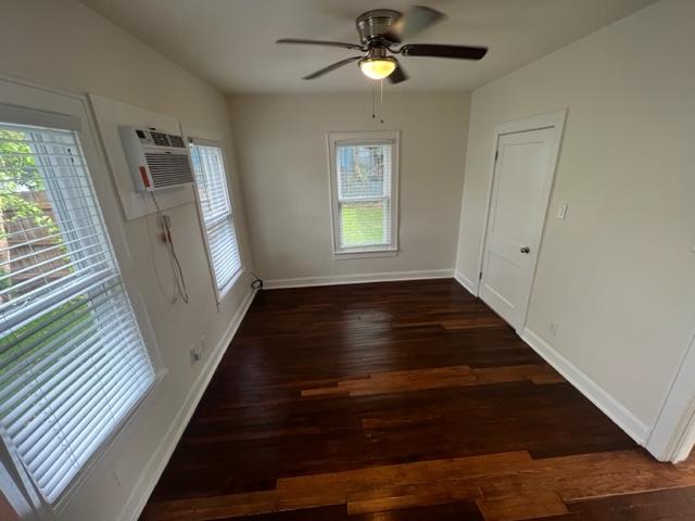 4417 Lucksinger Lane, Unit B Austin, TX 78745 - Photo 7 of 12 wooden floor in an empty room with a window