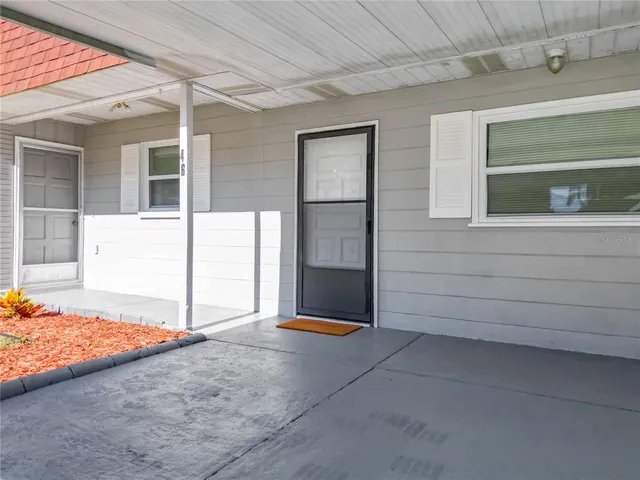 a view of backyard with tub
