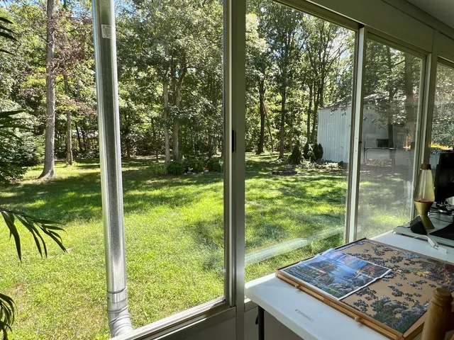 a view of backyard with green space