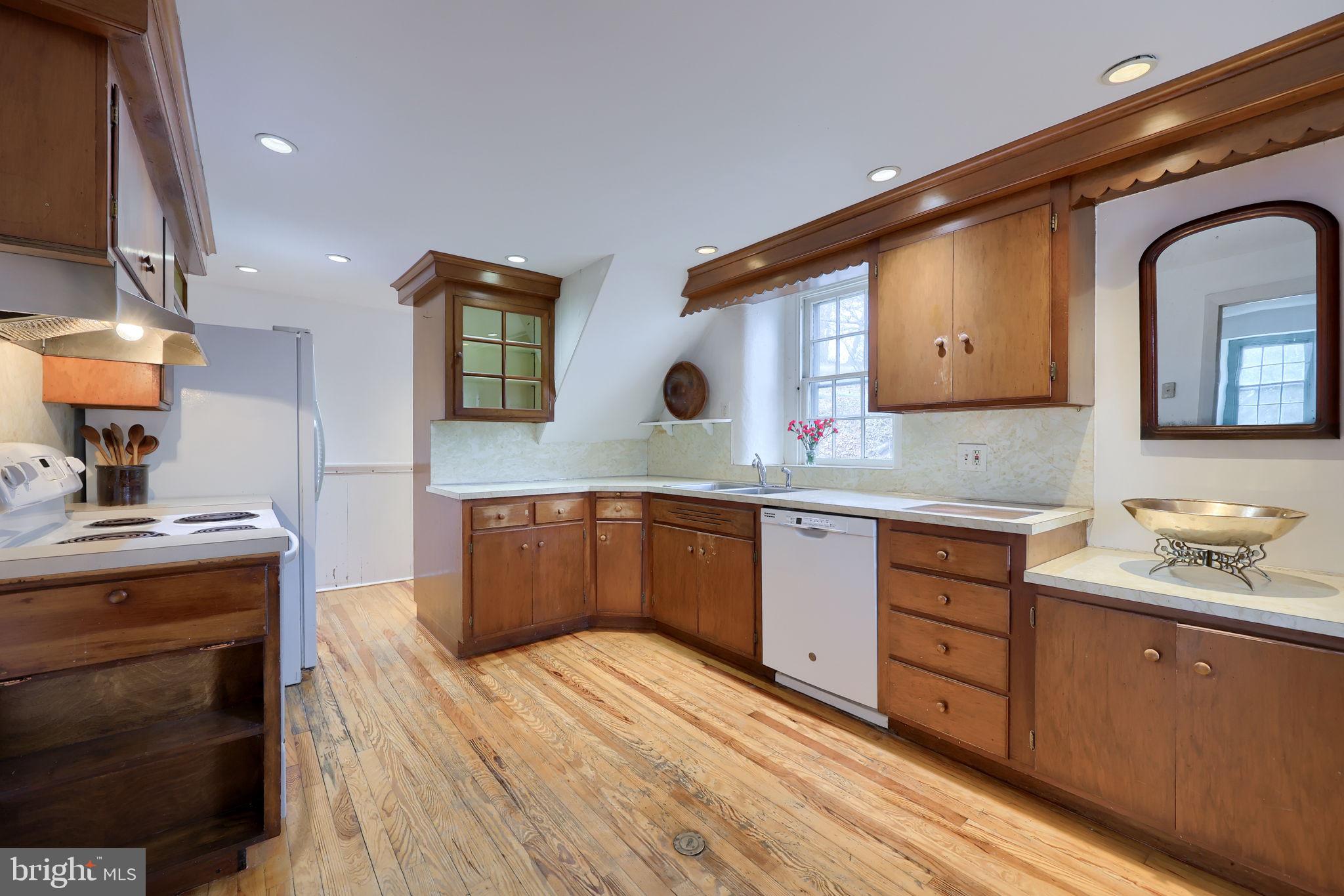 550 Speedwell Forge Road Lititz, PA 17543 - Photo 20 of 92 a kitchen with stainless steel appliances granite countertop a sink stove and cabinets