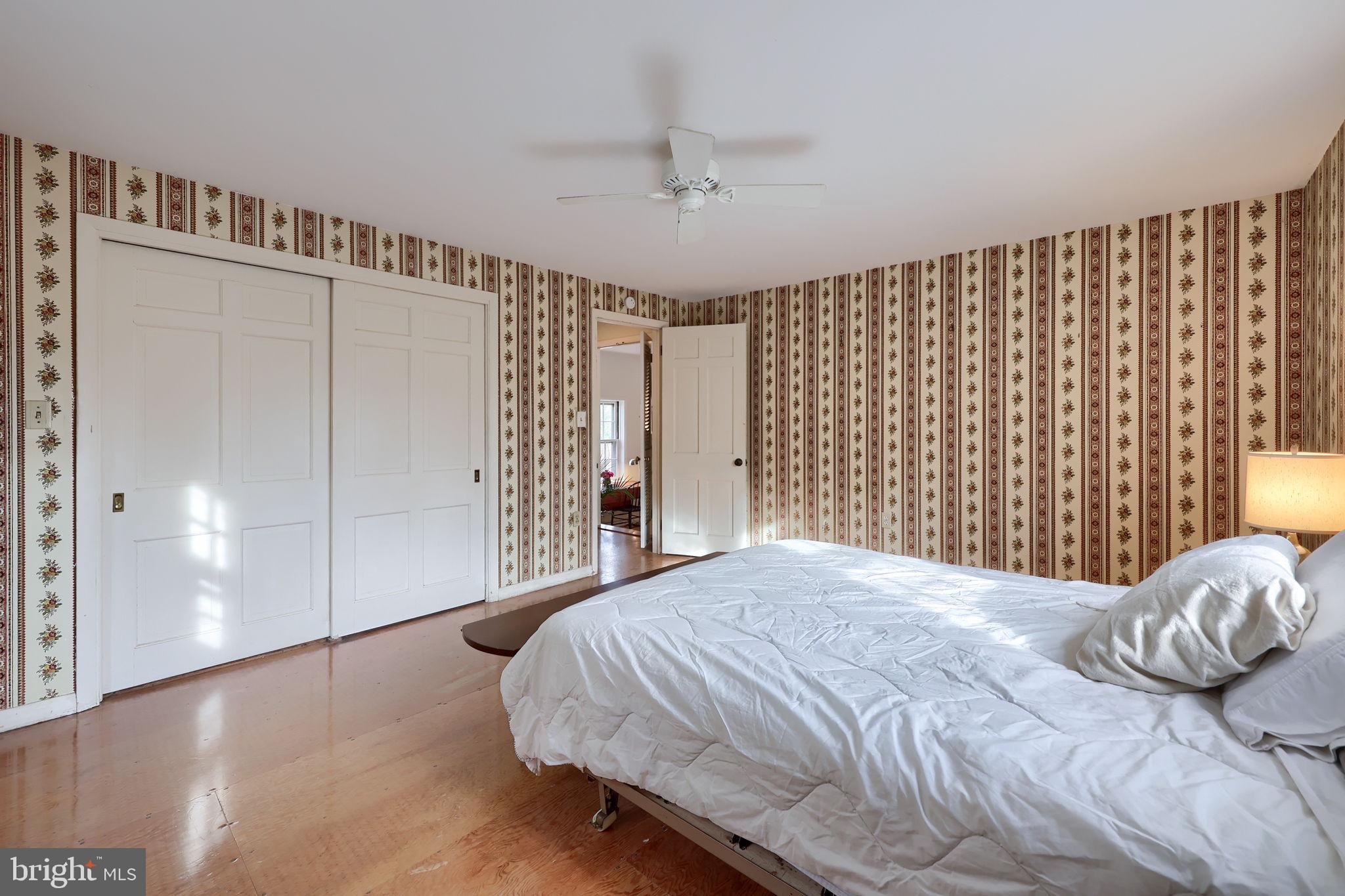 550 Speedwell Forge Road Lititz, PA 17543 - Photo 32 of 92 a bedroom with a large bed and a chandelier