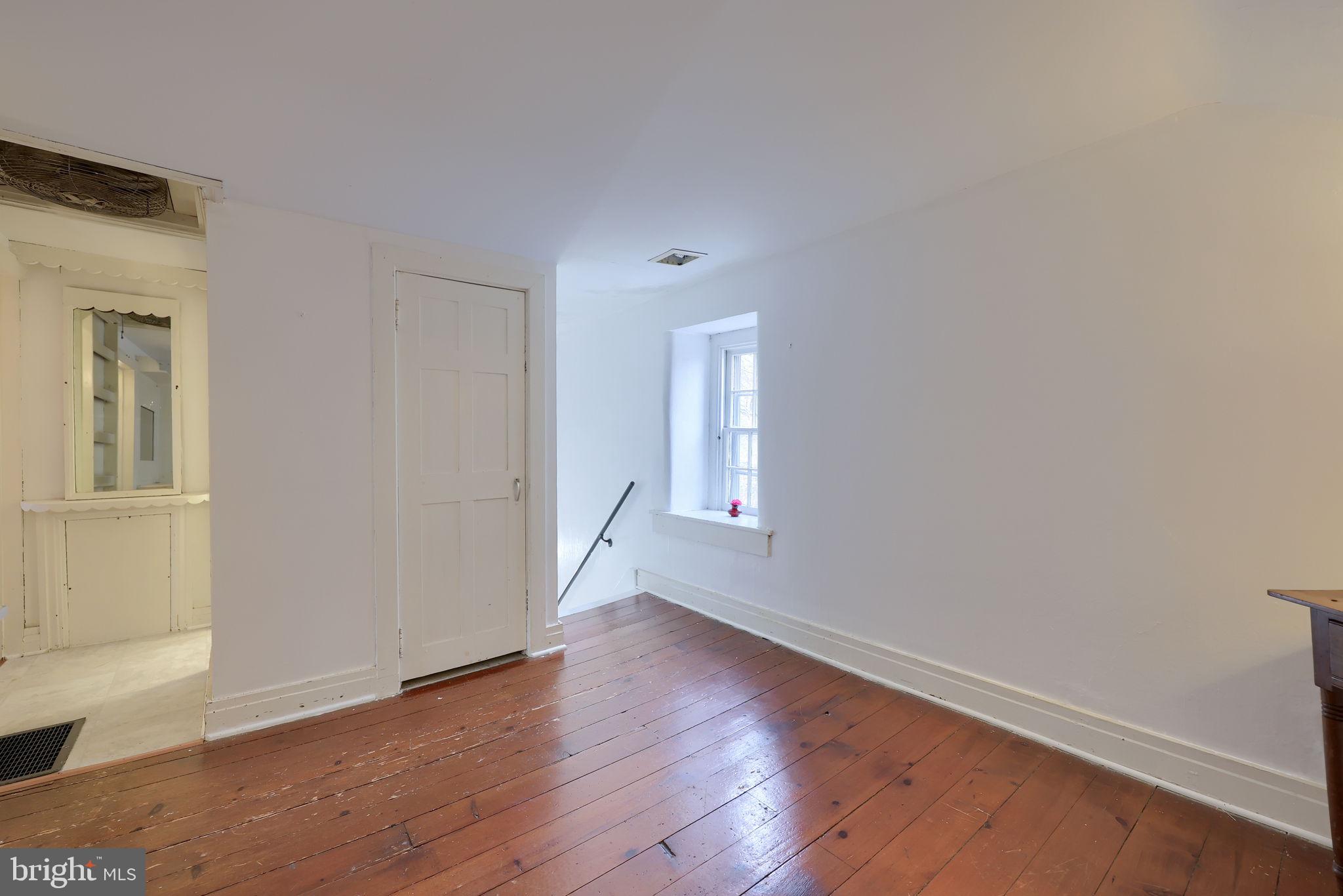 550 Speedwell Forge Road Lititz, PA 17543 - Photo 45 of 92 a view of an empty room with wooden floor and a window