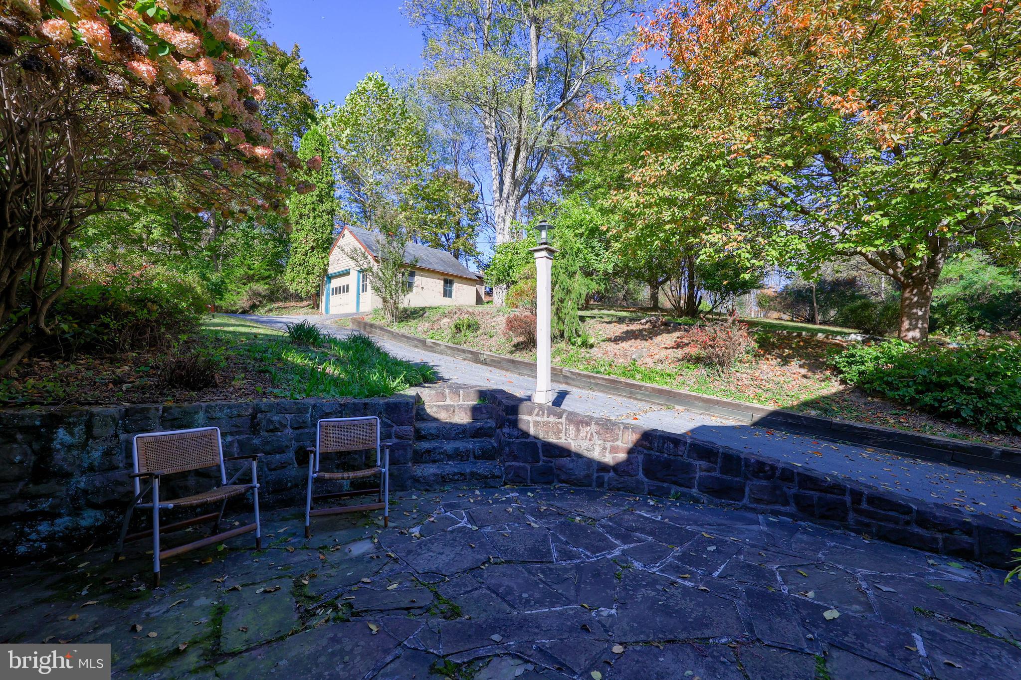 550 Speedwell Forge Road Lititz, PA 17543 - Photo 67 of 92 a view of a patio with table and chairs potted plants and large tree