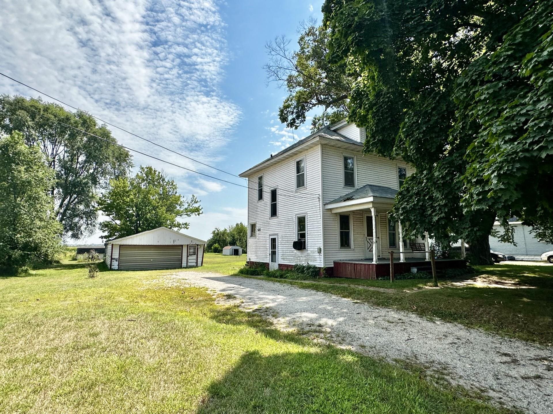 1898 Il Route Thomson, IL 61285 - Photo 2 of 18 a view of a house with a big yard and large trees