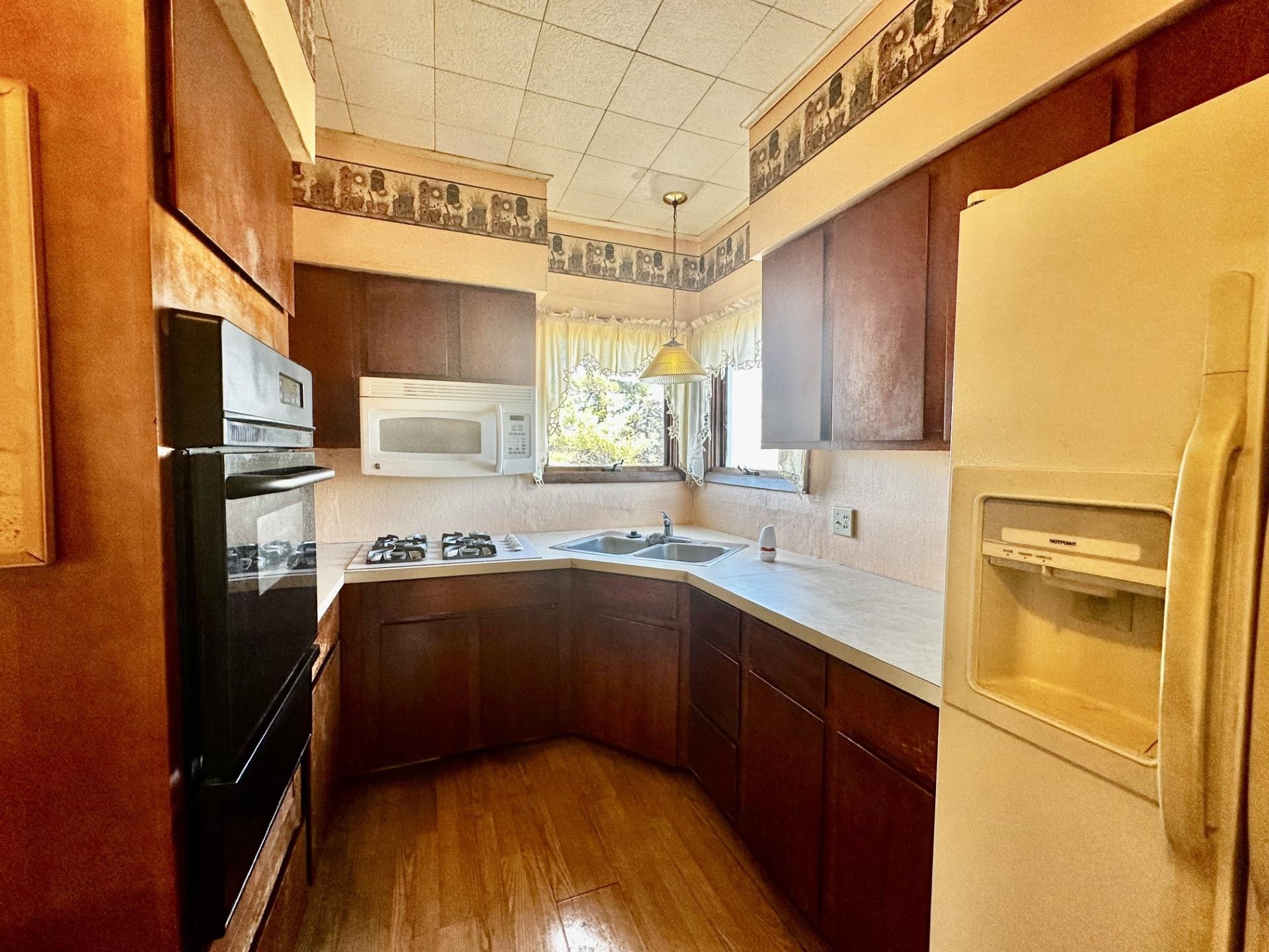 1898 Il Route Thomson, IL 61285 - Photo 3 of 18 a kitchen with stainless steel appliances a sink and cabinets