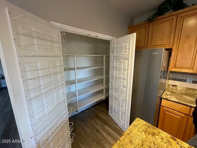 a bathroom with a sink and a refrigerator