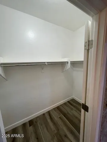 a view of an empty walk in closet