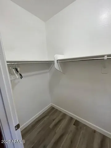 a room with granite countertop cabinets and sink