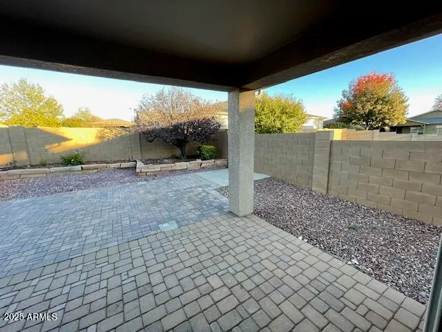 a view of a porch with furniture and floor to ceiling window