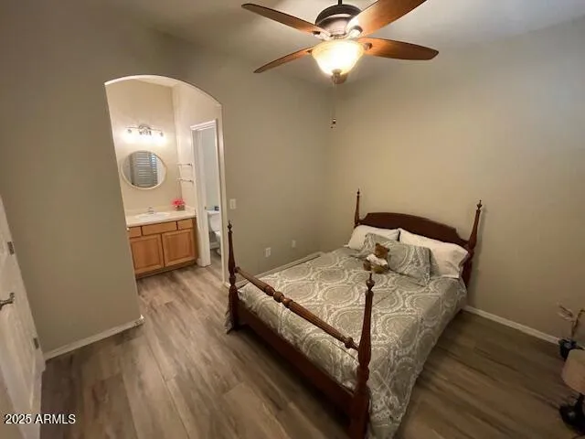 a bed room with a bed and a mirror