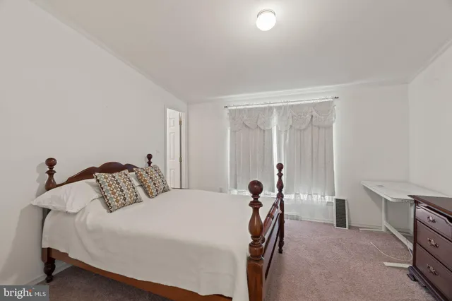 a bedroom with a bed and a cabinets