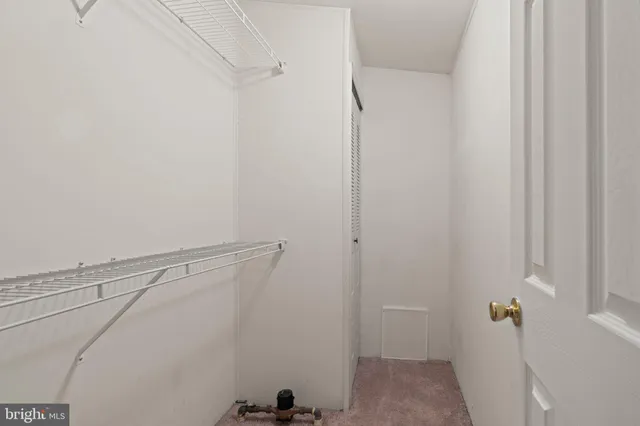 a view of a room with racks on the wall