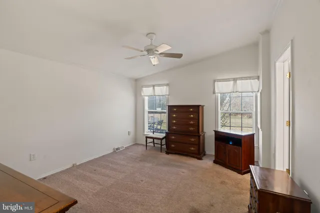 a view of workspace with furniture and window